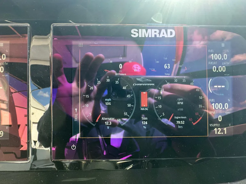 Slide: The Image of 2023 Chaparral 250 OSX boat interior with steering wheel and control panel. - 22