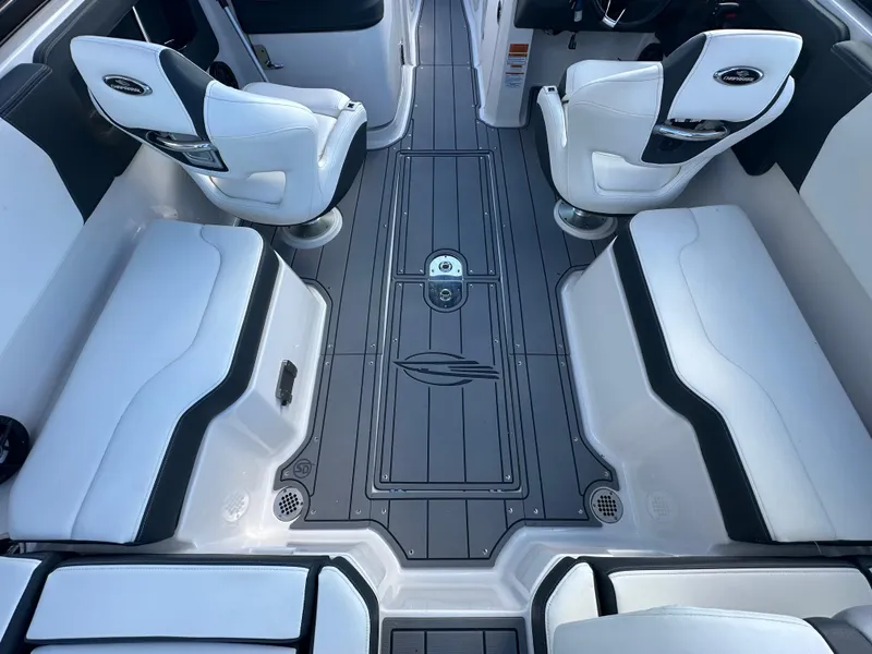 Slide: The Image of 2023 Chaparral 250 OSX boat interior with white seating and sleek design. - 35