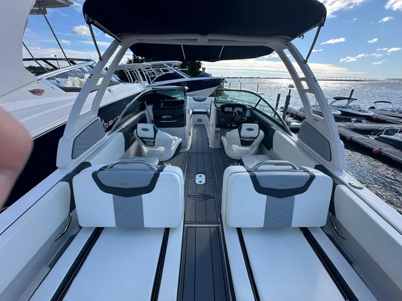 Slide: The Image of 2023 Chaparral 250 OSX boat interior with sleek seating and modern design. - 37