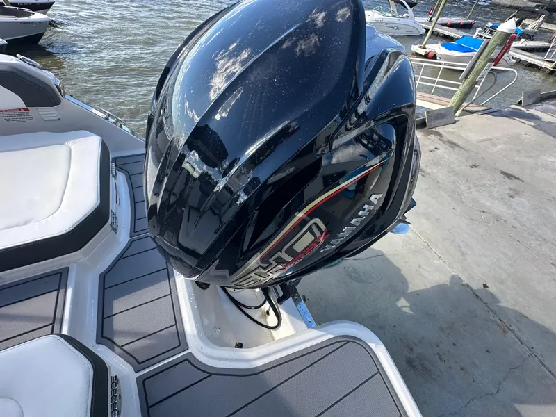 Slide: The Image of 2023 Chaparral 250 OSX boat with Yamaha outboard engine at dockside. - 38