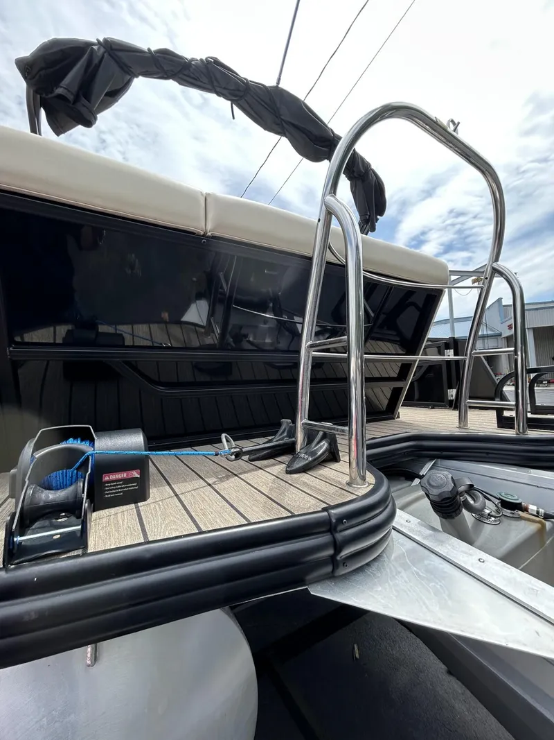 Slide: The Image of 2022 Lowe 190 SS boat with sleek deck and stainless steel ladder. - 15