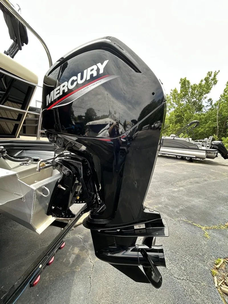Slide: The Image of 2022 Lowe 190 SS boat with Mercury outboard motor in a parking lot. - 16