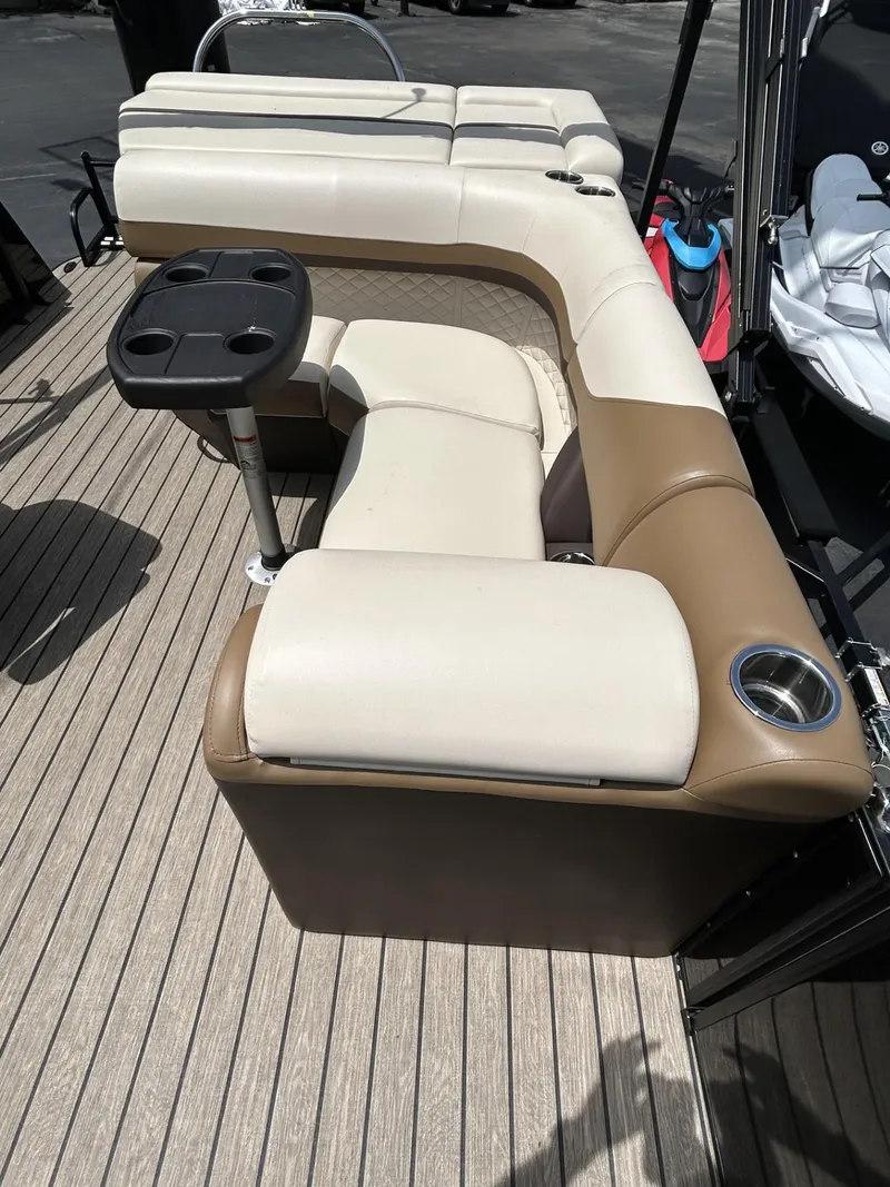 Slide: The Image of 2022 Lowe 190 SS boat interior with beige seating and cup holders. - 6