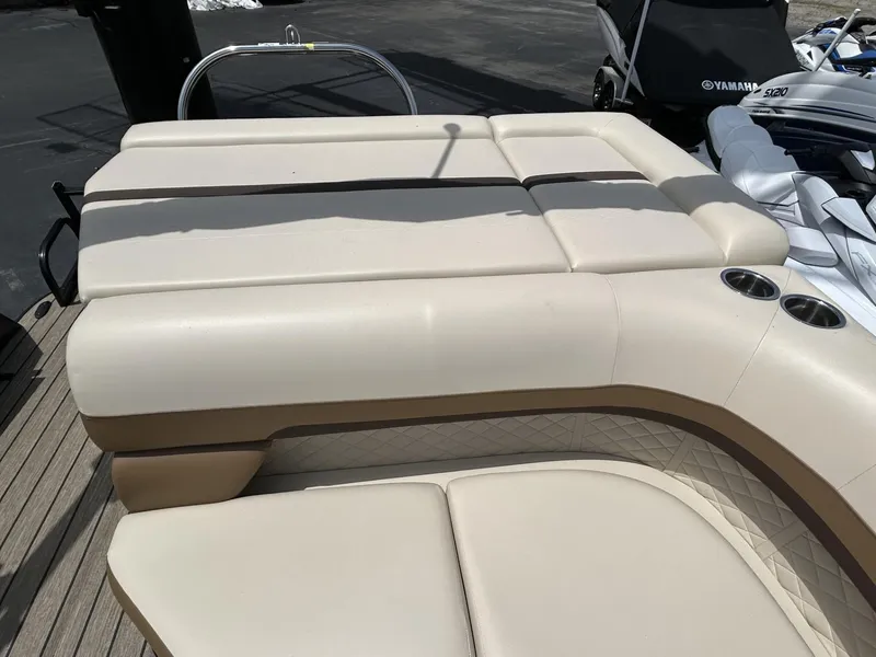 Slide: The Image of 2022 Lowe 190 SS boat with beige seating and cup holders on deck. - 7