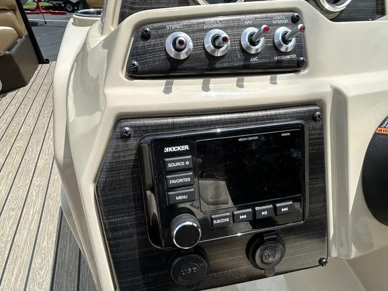 Slide: The Image of Control panel of 2022 Lowe 190 SS boat with audio system and switches. - 8