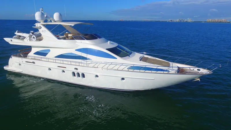 Slide: The Image of Luxury 2005 Azimut 80 Carat yacht cruising on open blue sea. - 12