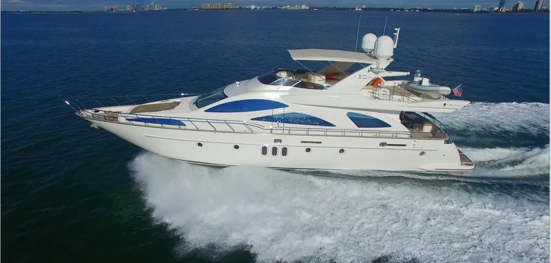 Slide: The Image of Azimut 80 Carat 2005 yacht cruising on open water, side view. - 15
