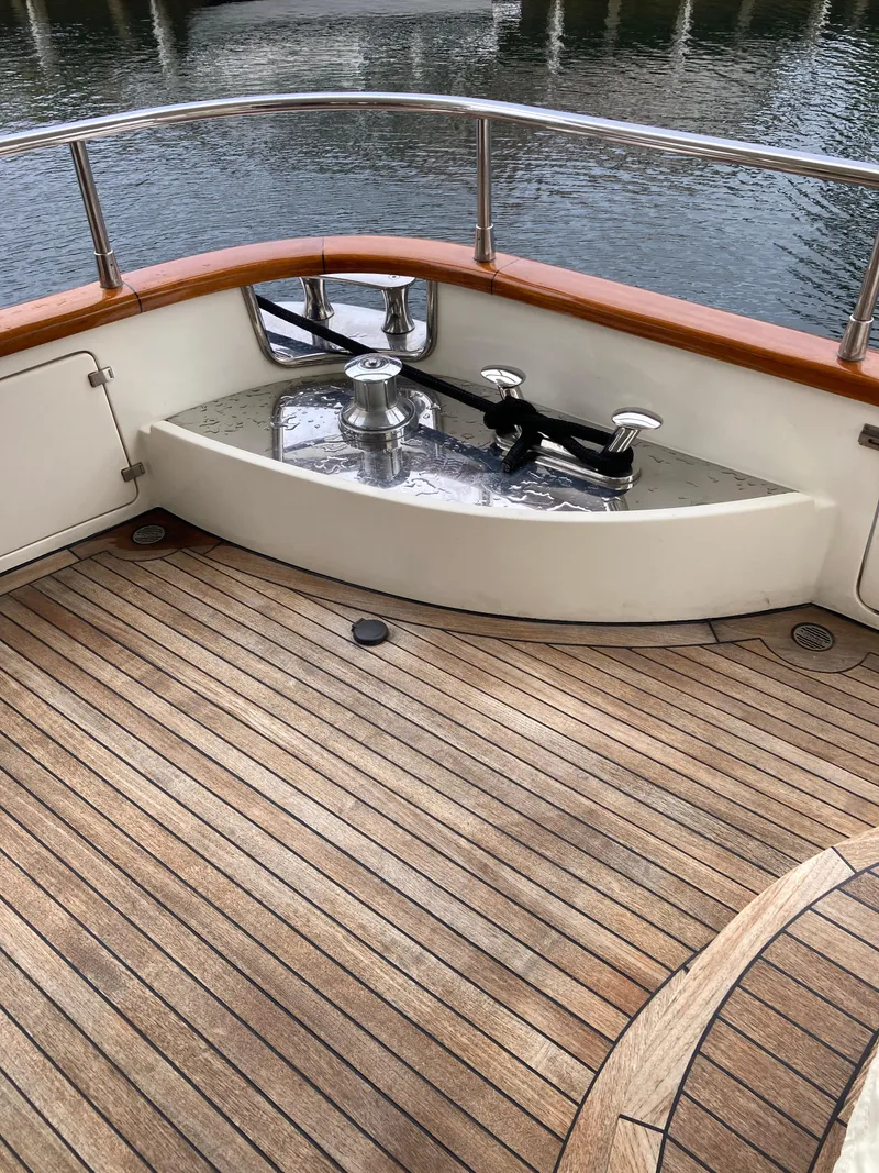 Slide: The Image of 2005 Azimut 80 Carat yacht deck with wicker basket and nautical equipment. - 18