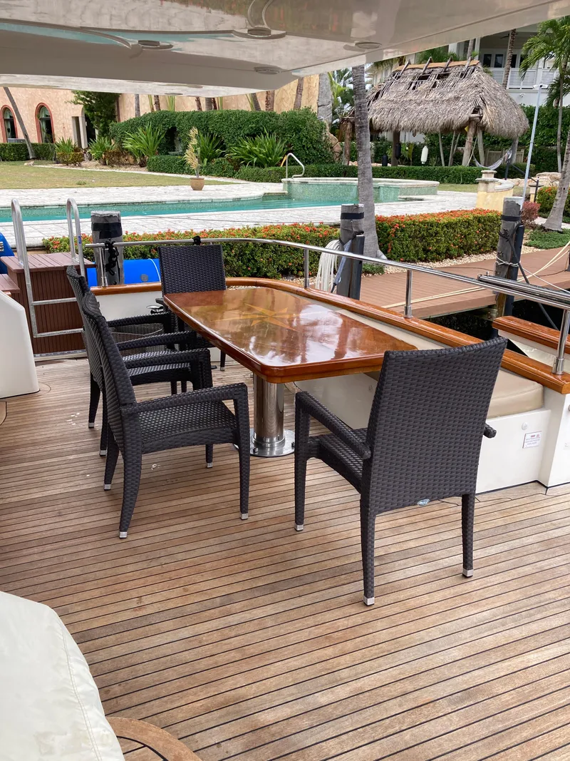 Slide: The Image of 2005 Azimut 80 Carat yacht deck with polished wood and stainless steel fittings. - 19