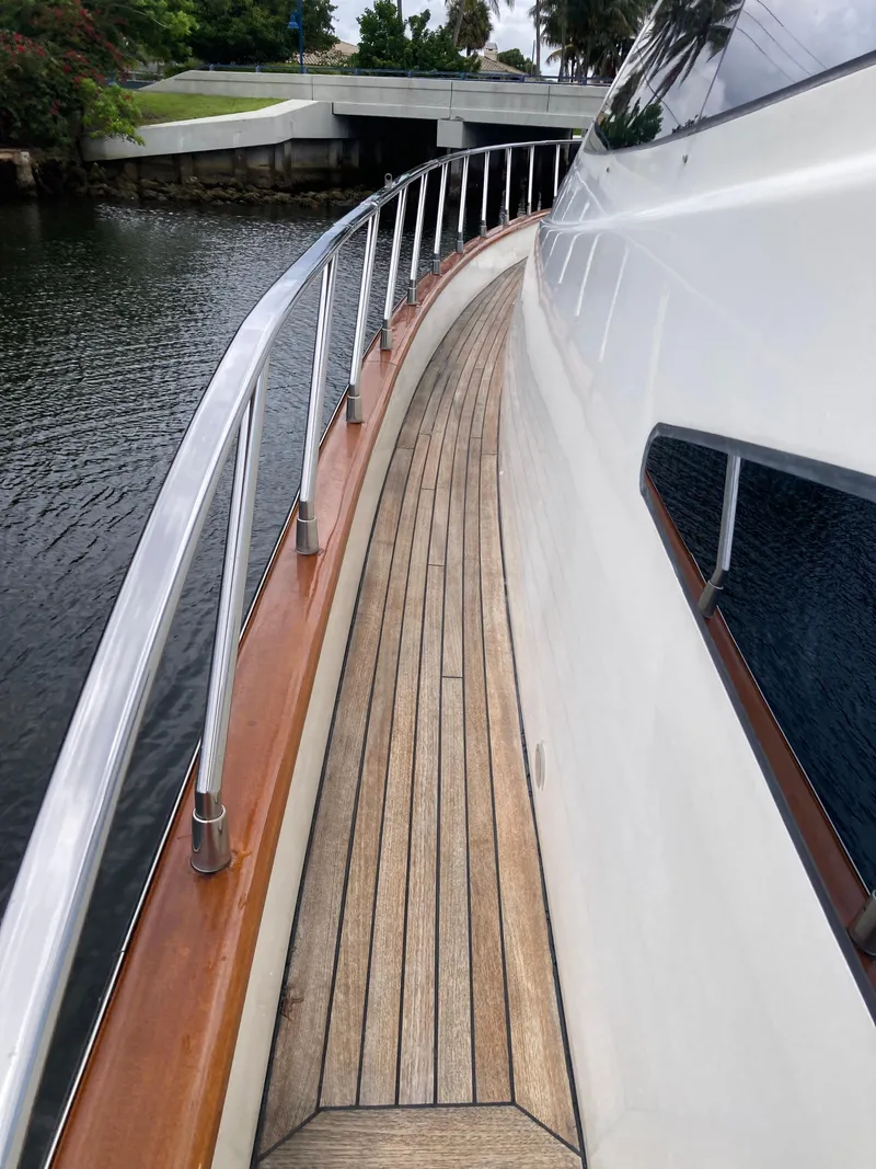 Slide: The Image of Side deck of a 2005 Azimut 80 Carat yacht with wooden flooring. - 26