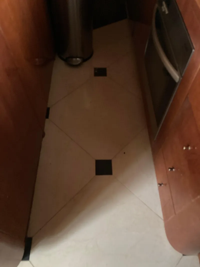 Slide: The Image of Luxurious interior of a 2005 Azimut 80 Carat yacht with elegant wood finishes. - 46