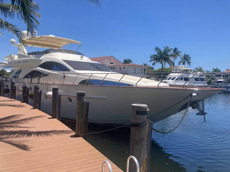 Slide: The Image of Luxury 2005 Azimut 80 Carat yacht docked in sunny marina setting. - 6