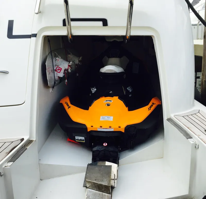 Slide: The Image of Jet ski stored in the rear compartment of a 2005 Azimut 80 Carat yacht. - 9