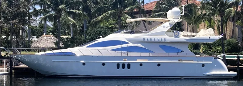 The Image of 2005 Azimut 80 Carat yacht docked, surrounded by palm trees and waterfront homes. - 0