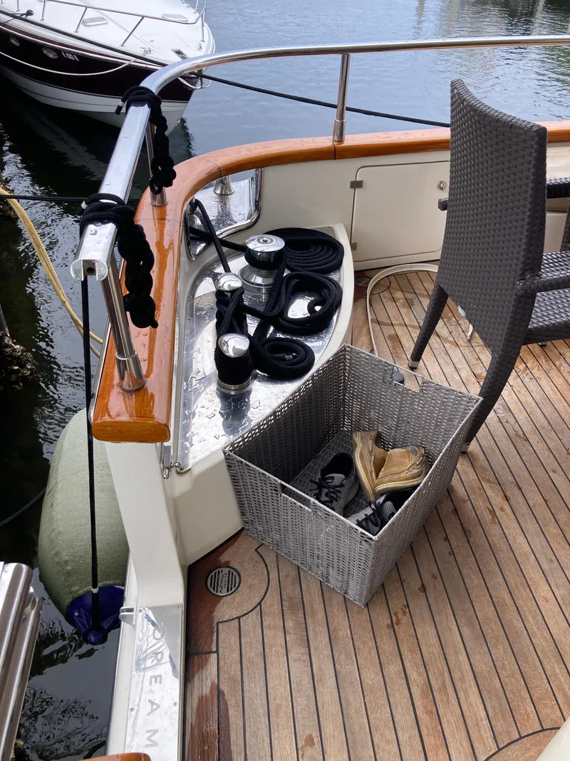 Slide: The Image of 2005 Azimut 80 Carat yacht deck with wicker basket and nautical equipment. - 17
