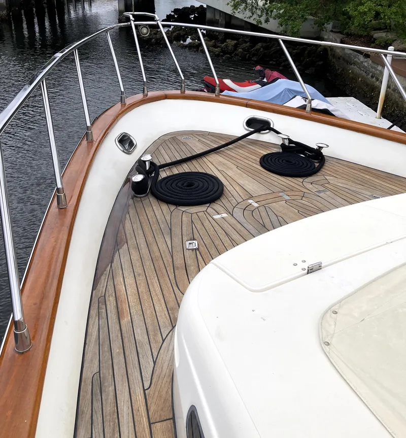Slide: The Image of Deck view of 2005 Azimut 80 Carat yacht with wooden flooring and railing. - 27