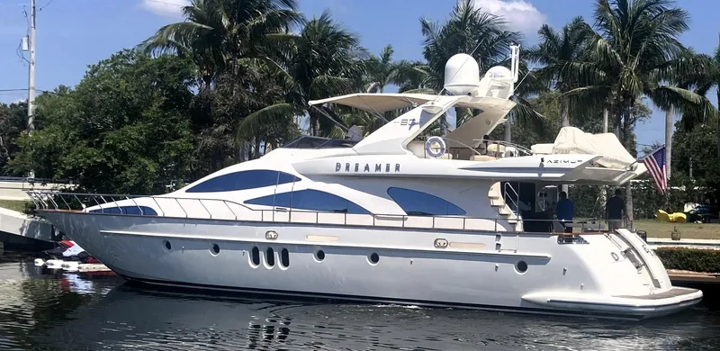 Slide: The Image of 2005 Azimut 80 Carat yacht docked by palm trees, named "Dreamer." - 4