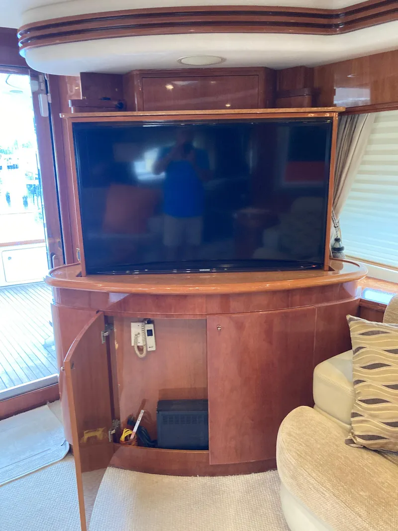 Slide: The Image of Luxurious interior of 2005 Azimut 80 Carat yacht with elegant wood finishes and plush seating. - 40