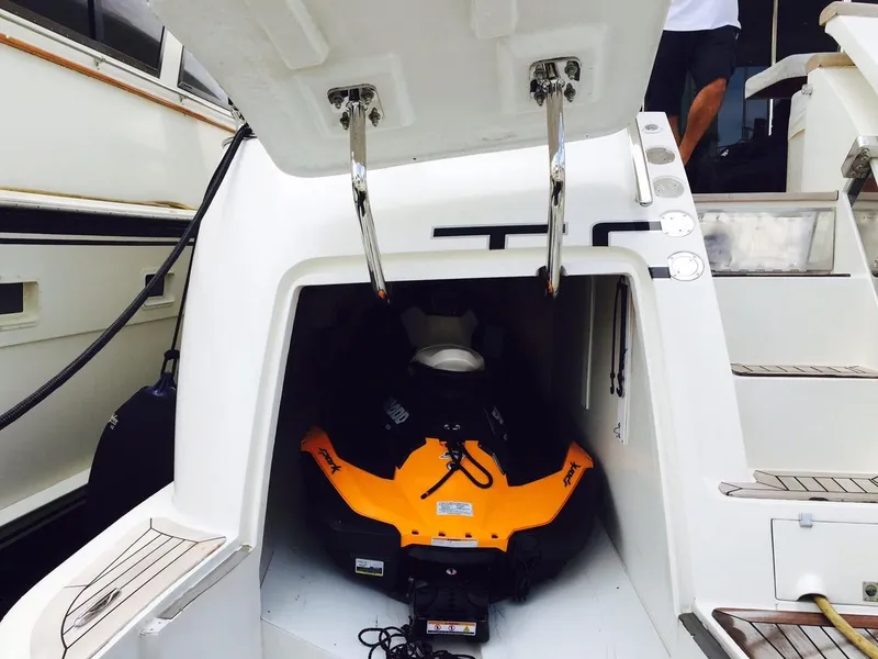 Slide: The Image of 2005 Azimut 80 Carat yacht with a jet ski stored in the rear compartment. - 8