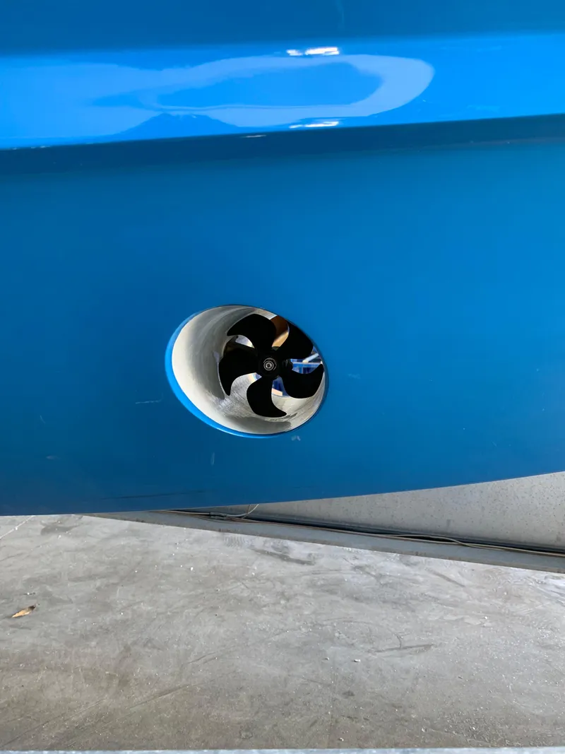 Slide: The Image of 2022 Yellowfin 39 Offshore boat with a blue hull and visible thruster. - 10
