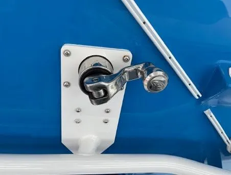 Slide: The Image of Chrome handle on 2022 Yellowfin 39 Offshore boat against blue background. - 15