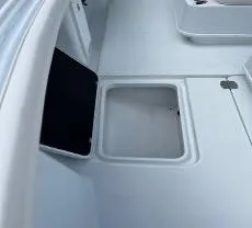 Slide: The Image of Open storage compartment on 2022 Yellowfin 39 Offshore boat deck. - 19