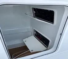 Slide: The Image of 2022 Yellowfin 39 Offshore boat storage compartment with open access panels. - 21