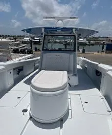 Slide: The Image of 2022 Yellowfin 39 Offshore boat docked at marina under clear sky. - 23