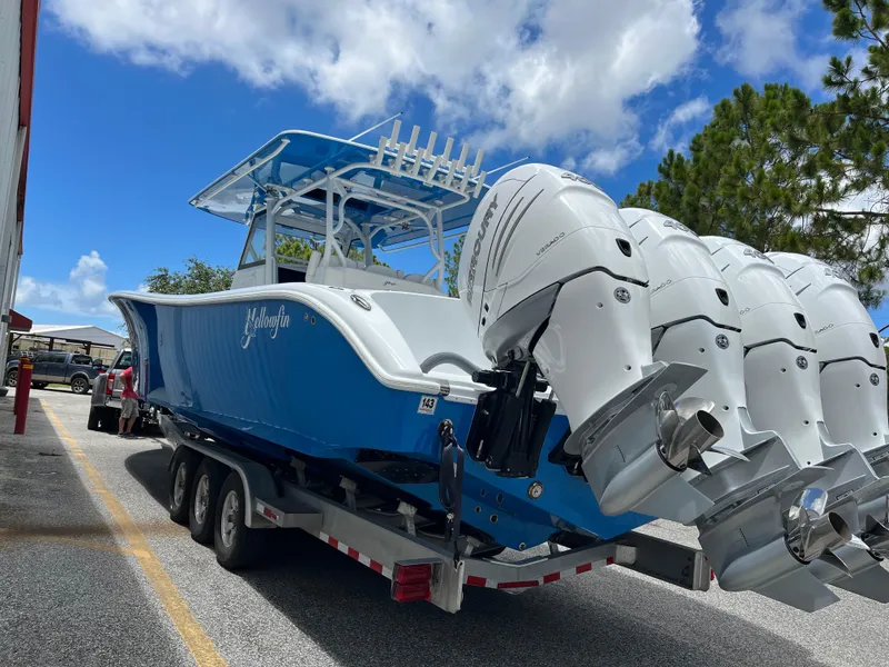 Slide: The Image of 2022 Yellowfin 39 Offshore boat with triple outboard engines on a trailer. - 3