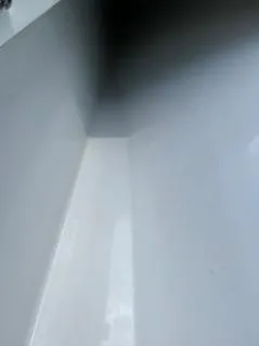 Slide: The Image of Close-up of a 2022 Yellowfin 39 Offshore boat interior, showcasing sleek white surfaces. - 32