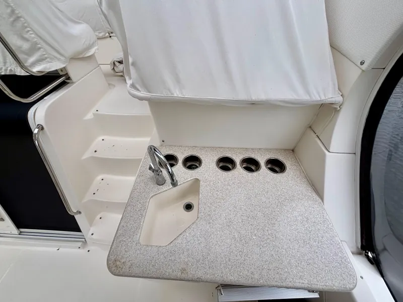 Slide: The Image of 2005 Silverton 39 Motor Yacht interior with sink and cup holders. - 13