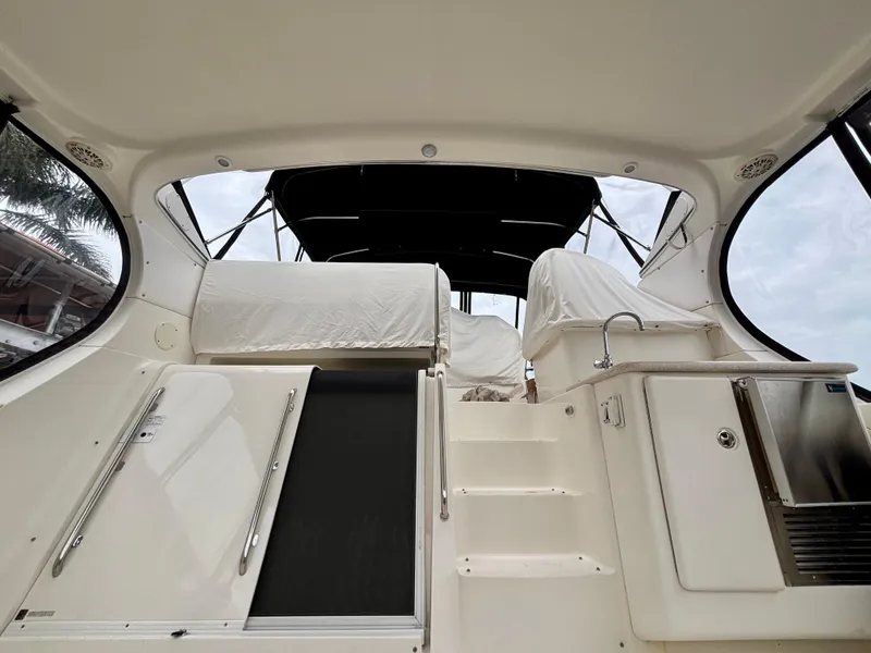 Slide: The Image of 2005 Silverton 39 Motor Yacht interior with covered seating and steps, featuring sleek design elements. - 15
