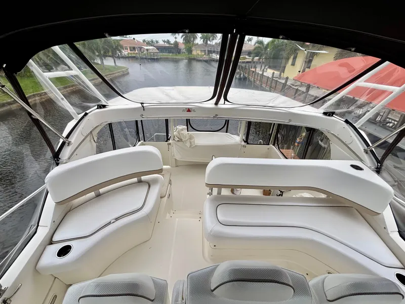 Slide: The Image of 2005 Silverton 39 Motor Yacht interior with spacious seating and panoramic water views. - 18