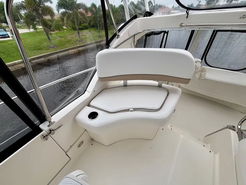 Slide: The Image of 2005 Silverton 39 Motor Yacht interior with white seating and water view. - 19