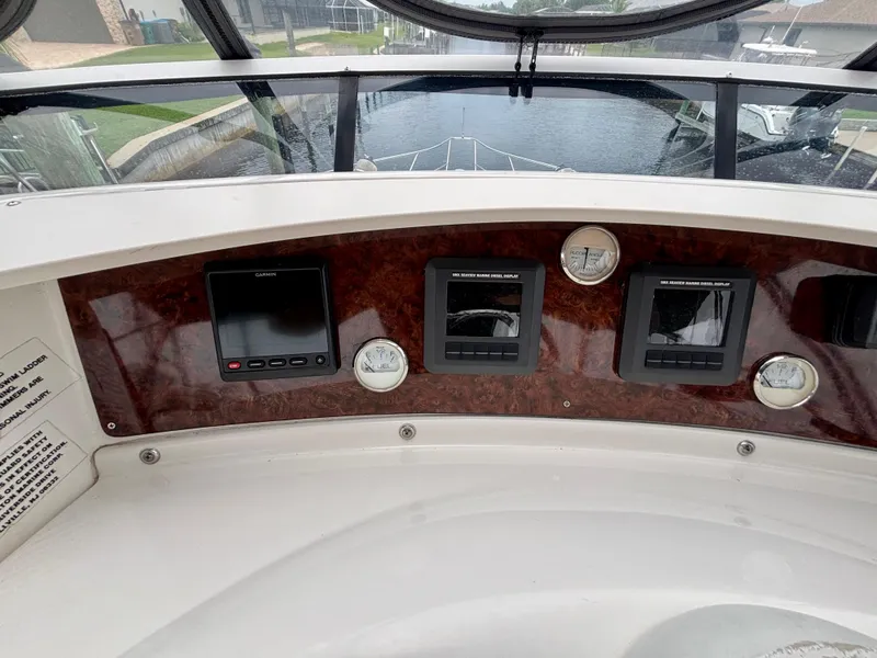 Slide: The Image of 2005 Silverton 39 Motor Yacht dashboard with navigation instruments and gauges. - 23