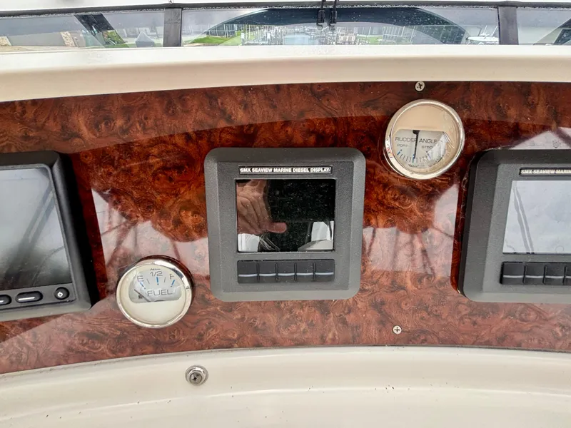 Slide: The Image of Dashboard of 2005 Silverton 39 Motor Yacht with gauges and displays. - 25