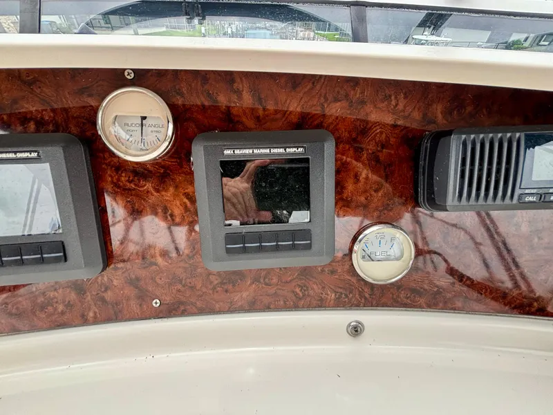 Slide: The Image of Dashboard of 2005 Silverton 39 Motor Yacht with gauges and electronic displays. - 26