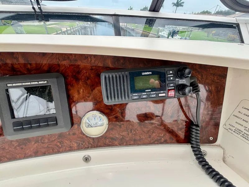 Slide: The Image of 2005 Silverton 39 Motor Yacht dashboard with radio and control panel. - 27