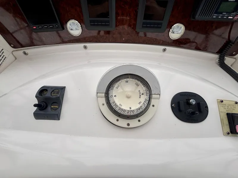 Slide: The Image of Dashboard of 2005 Silverton 39 Motor Yacht with compass and controls. - 28