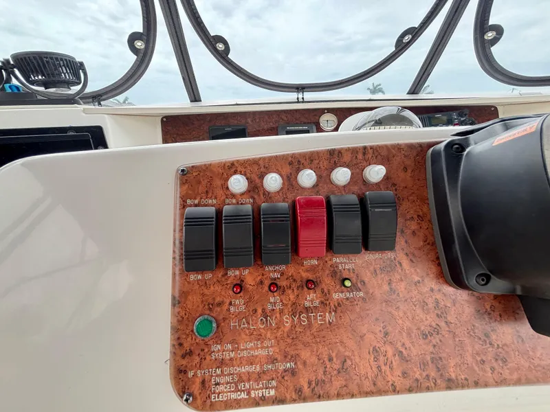 Slide: The Image of Control panel of a 2005 Silverton 39 Motor Yacht with switches and indicators. - 30