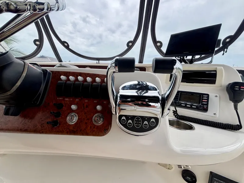 Slide: The Image of Control panel of a 2005 Silverton 39 Motor Yacht with steering and navigation equipment. - 32