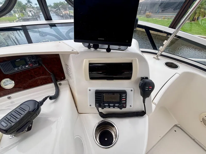 Slide: The Image of 2005 Silverton 39 Motor Yacht helm with navigation equipment and controls. - 34