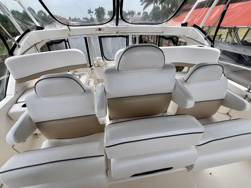 Slide: The Image of 2005 Silverton 39 Motor Yacht interior with white seating and panoramic windows. - 36