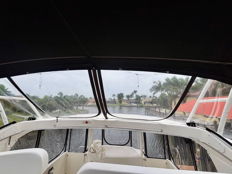 Slide: The Image of 2005 Silverton 39 Motor Yacht interior view with waterway and palm trees. - 42