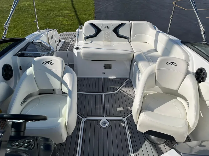 Slide: The Image of 2015 Monterey M4 boat interior with white seating and sleek design. - 12