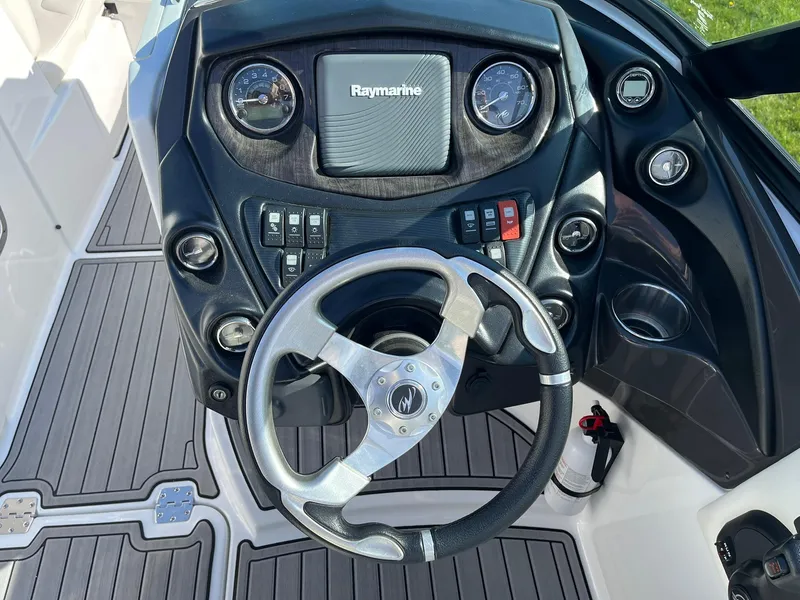 Slide: The Image of Steering console of a 2015 Monterey M4 boat with Raymarine navigation system. - 14