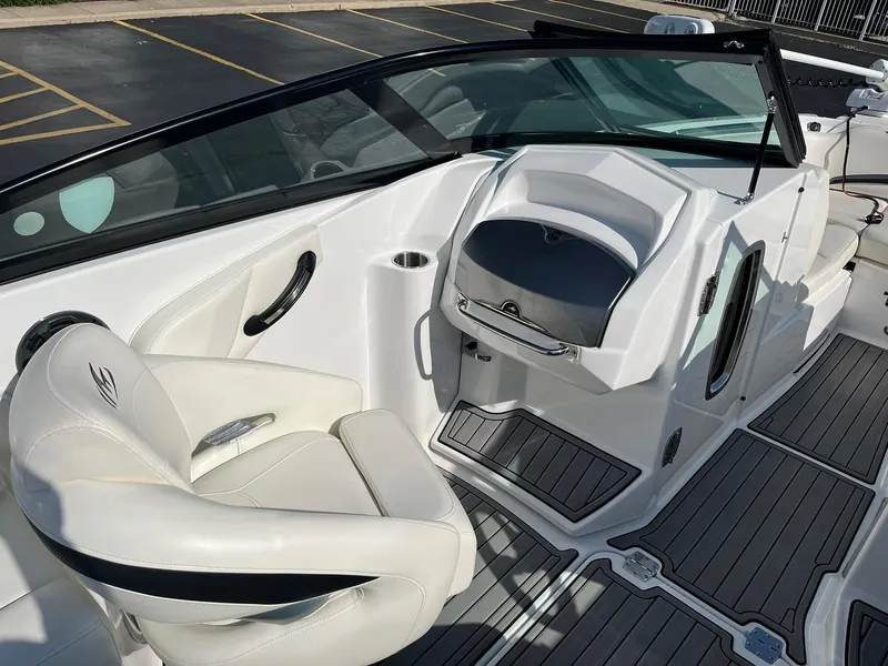 Slide: The Image of 2015 Monterey M4 boat interior with white seating and sleek dashboard design. - 19