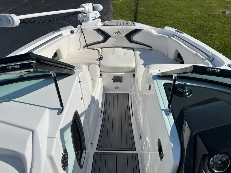Slide: The Image of 2015 Monterey M4 boat interior with white seating and sleek design. - 24