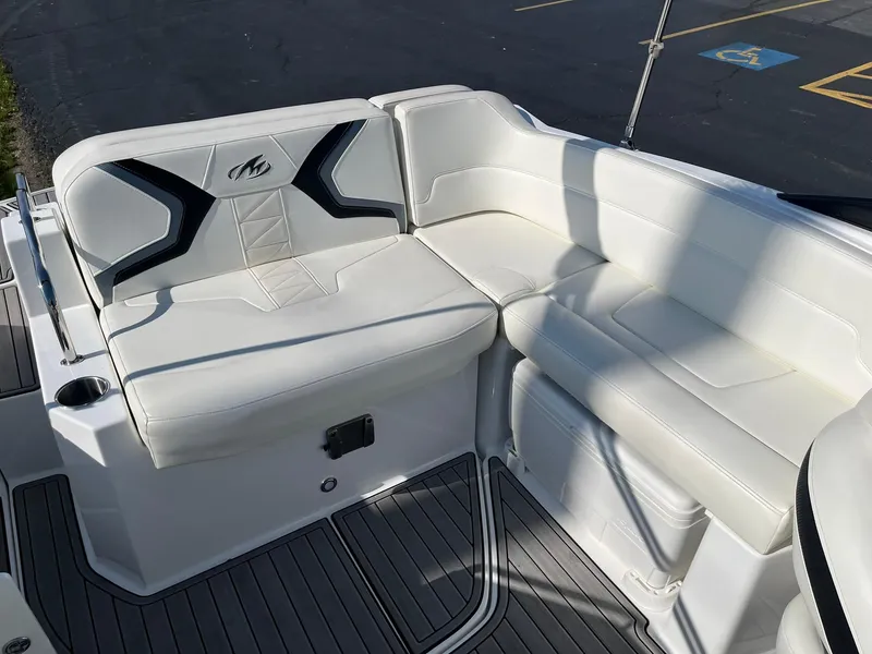 Slide: The Image of 2015 Monterey M4 boat with white leather seating and black accents. - 25