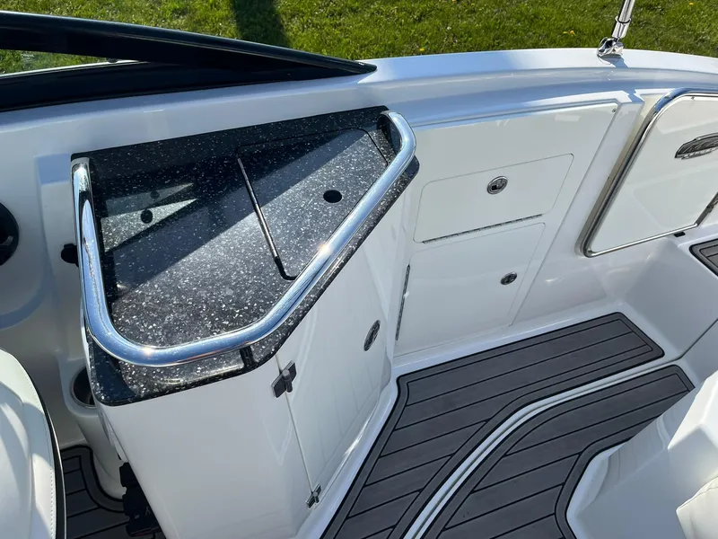 Slide: The Image of 2015 Monterey M4 boat interior with sleek countertop and storage compartments. - 32